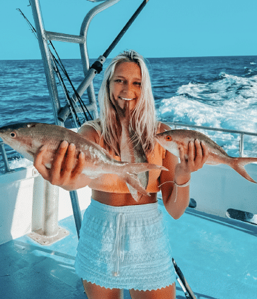 Girl with a catch at a party Boat Fishing