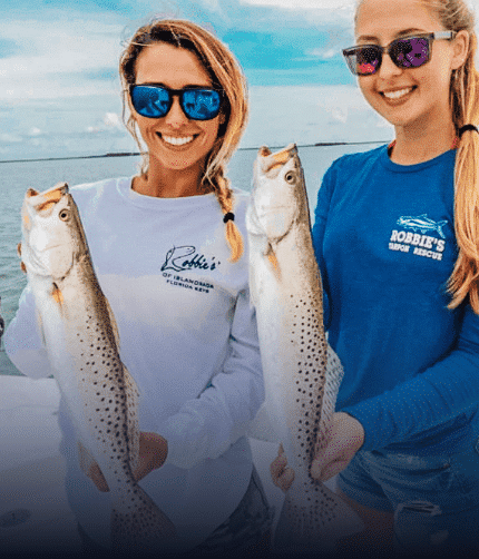 Women and two fishes