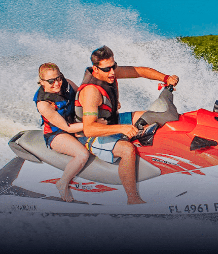 Women and men jet skiing